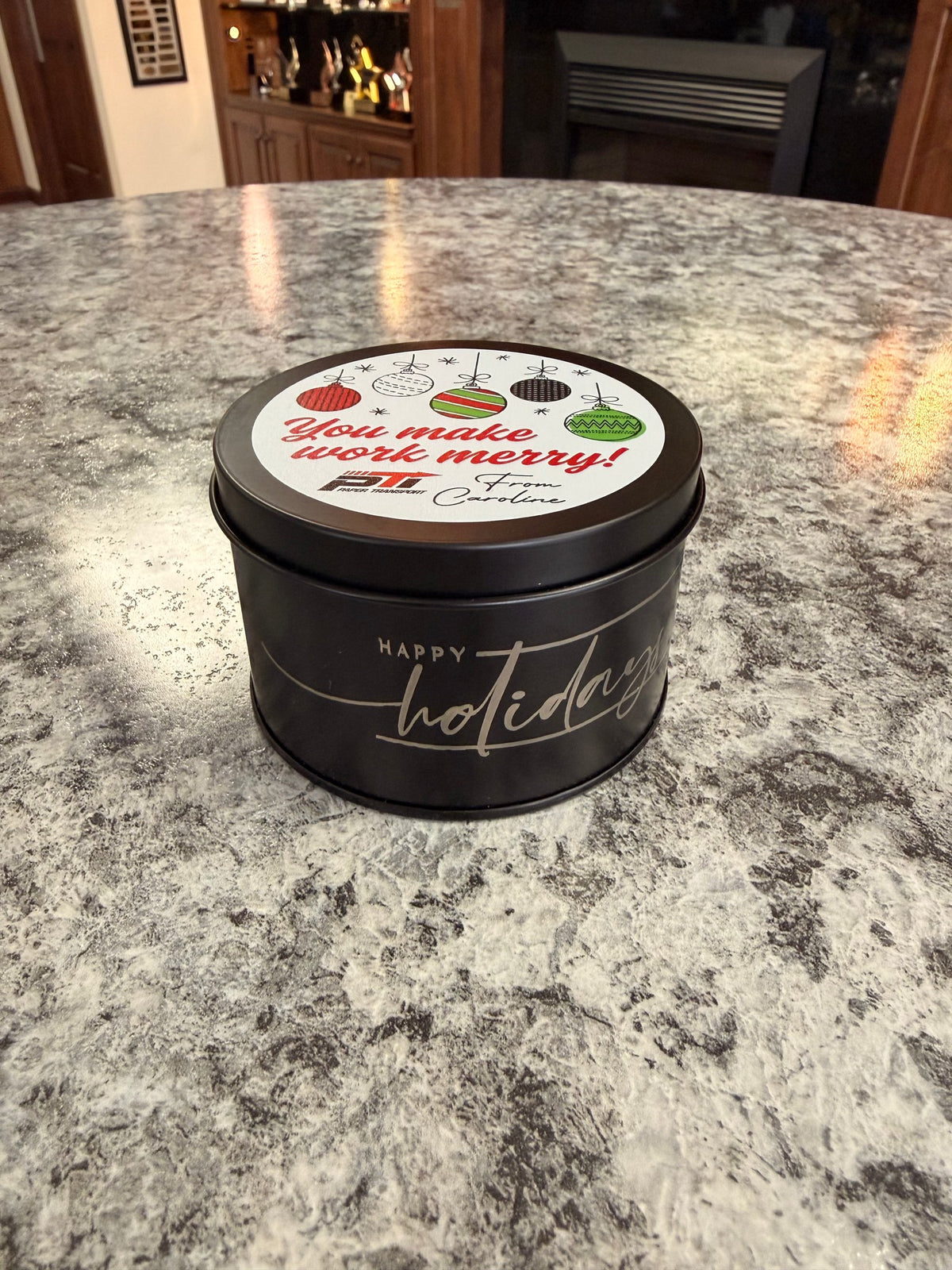 Closed black tin candle with full-color digital lid imprint and Happy Holidays side engraving