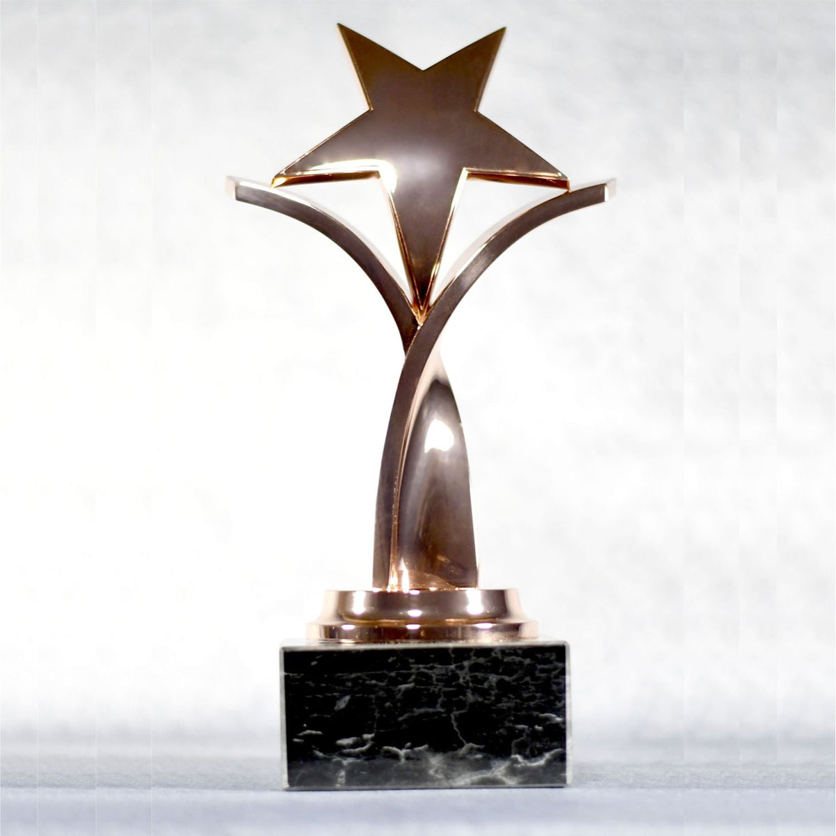 Twisting Star On Black Marble Base, front view