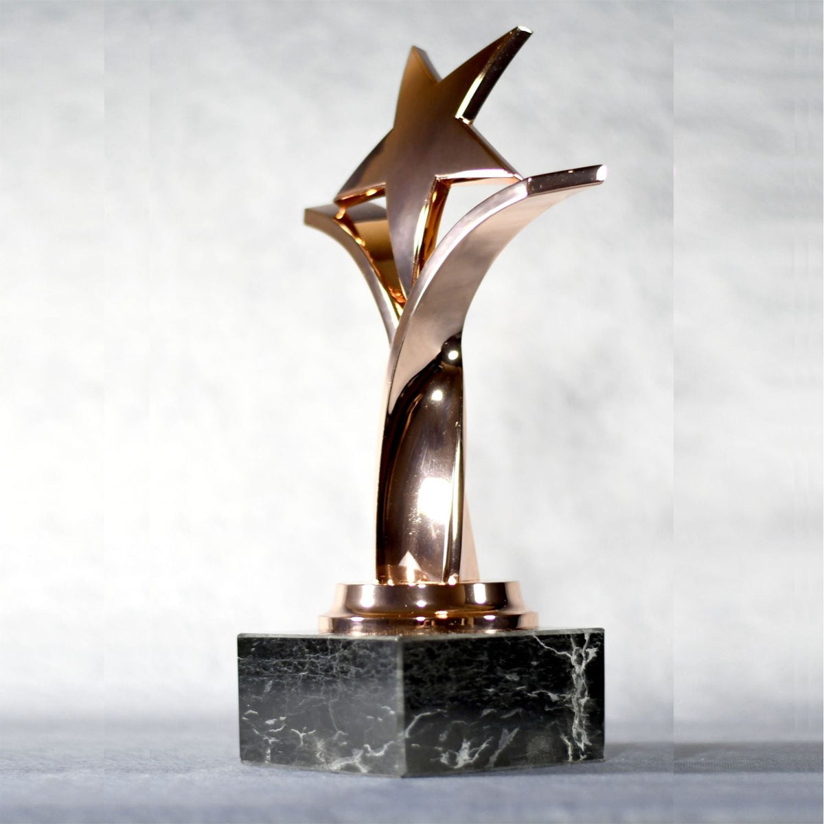 Twisting Star On Black Marble Base, Bronze, left side view
