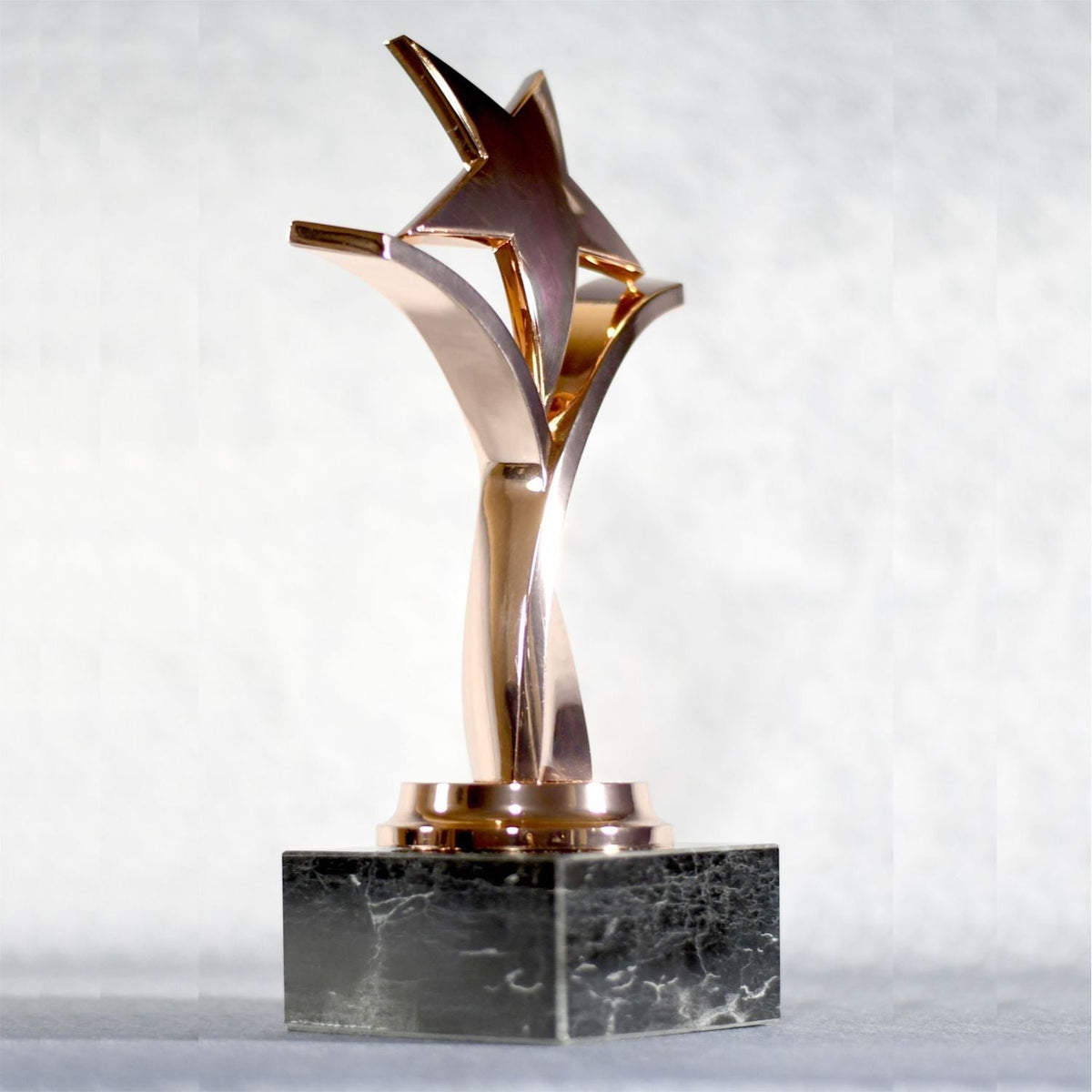 Twisting Star On Black Marble Base, right side view