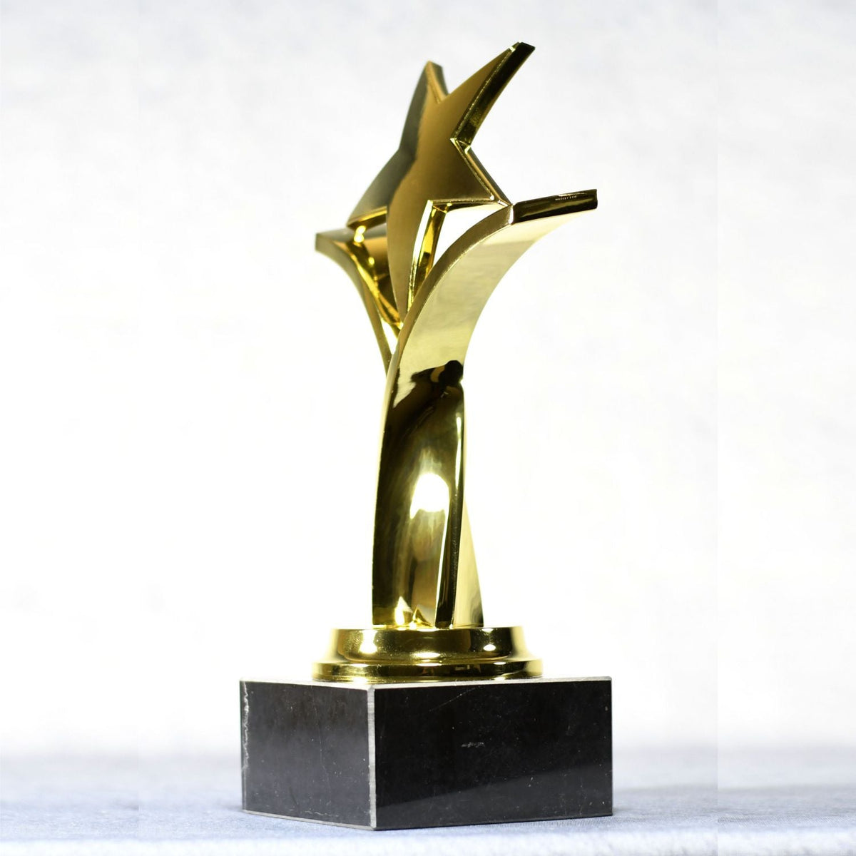 Twisting Star On Black Marble Base, left side view
