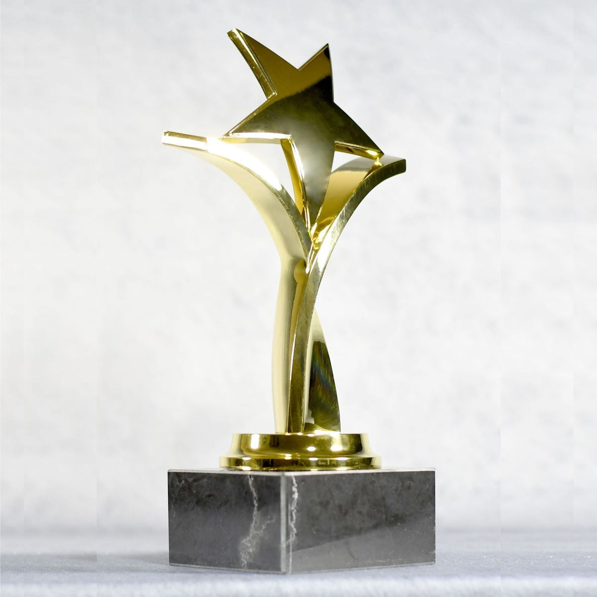 Twisting Star On Black Marble Base, Gold, right side view