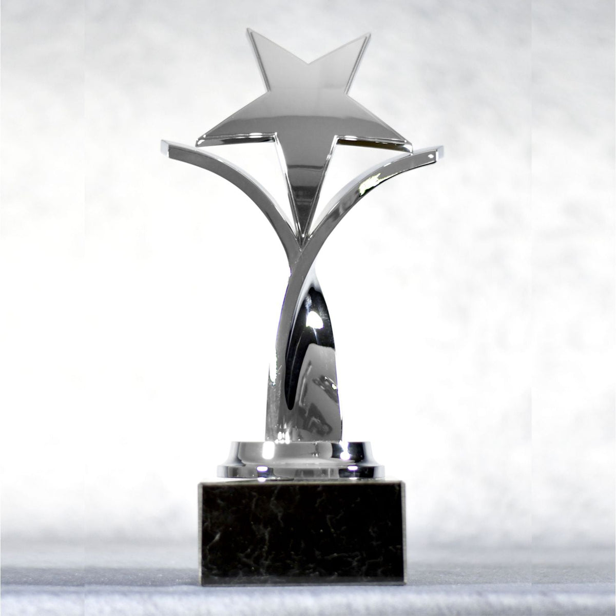 Twisting Star On Black Marble Base, Silver, front view