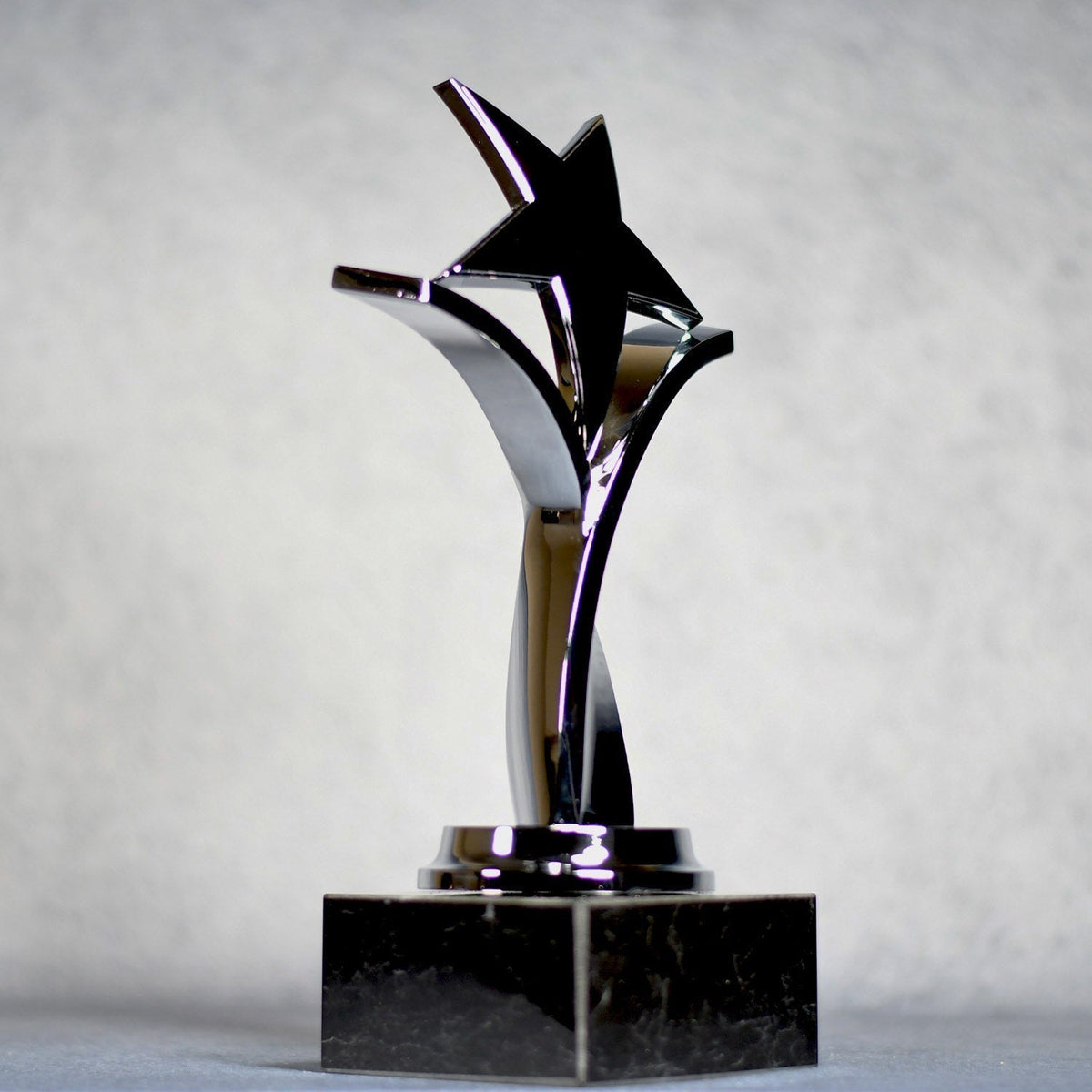 Twisting Star On Black Marble Base, right side view