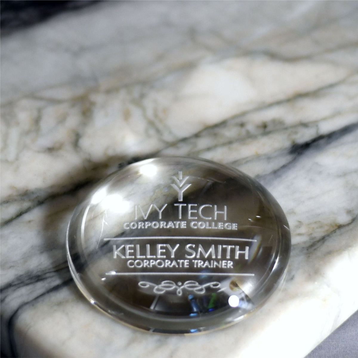 Crystal Paperweight - Low Profile Dome, shown in use
